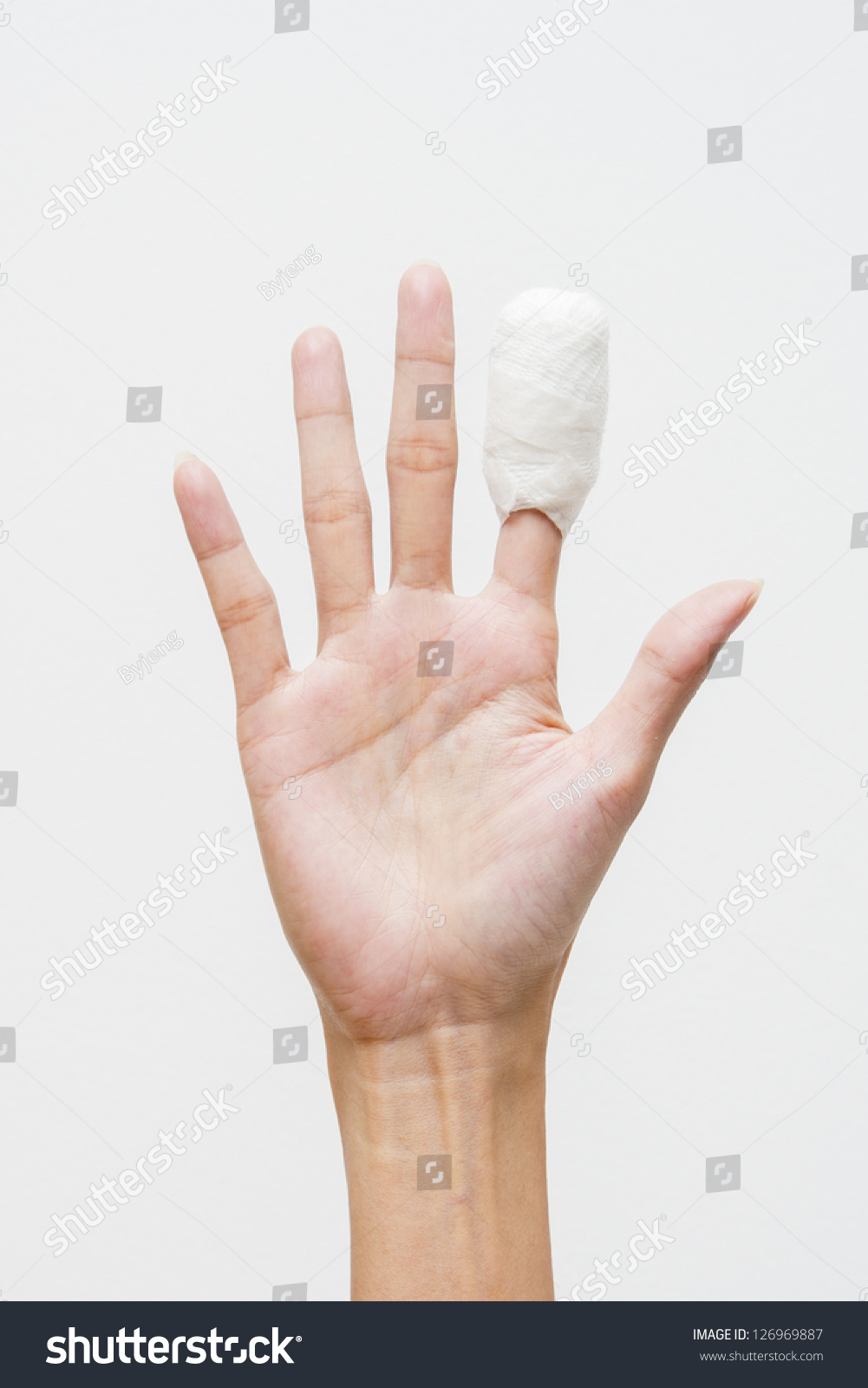 White Medicine Bandage On Human Injury Hand Finger Stock Photo