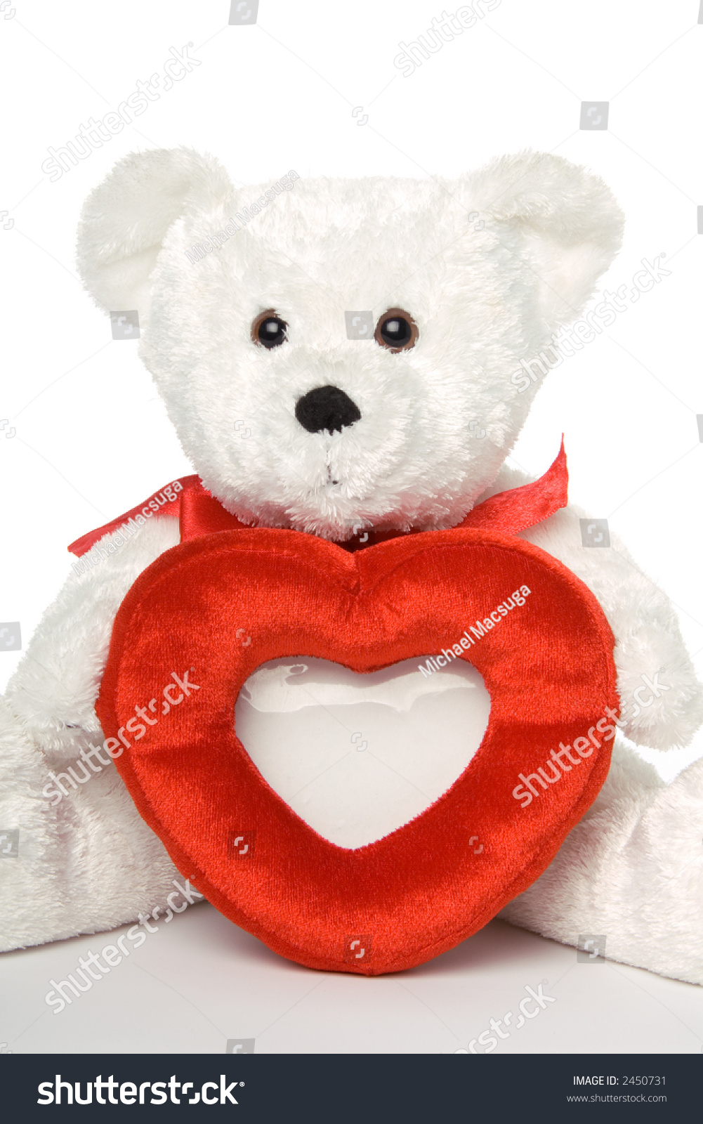 small teddy bear holding heart