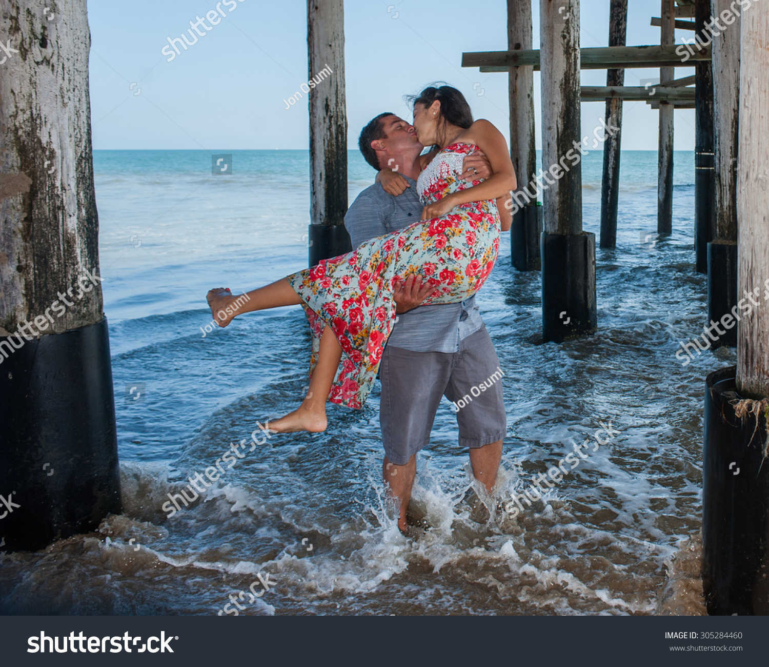 wife-swept-off-her-feet-with-a-kiss-stock-photo-305284460-shutterstock