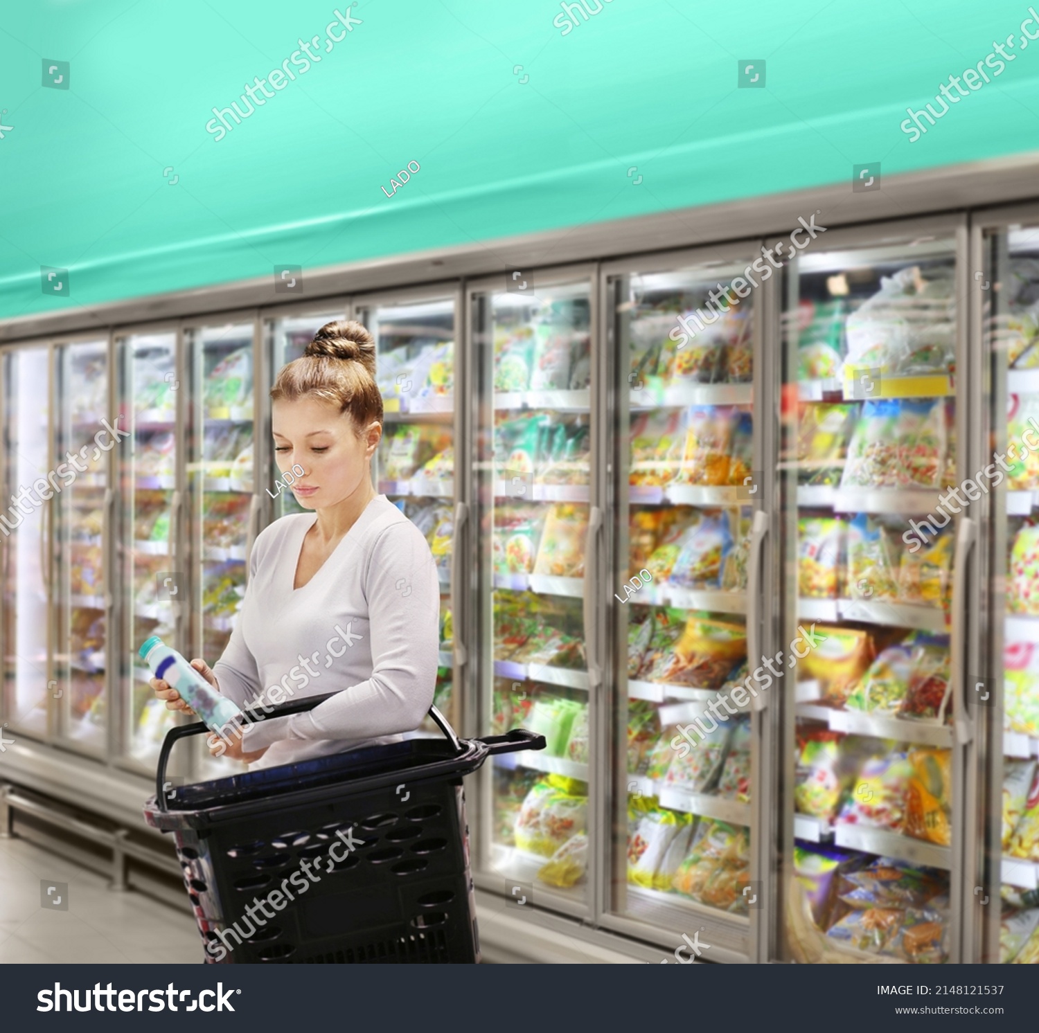 Woman Choosing Frozen Food Supermarket Freezer Stock Photo