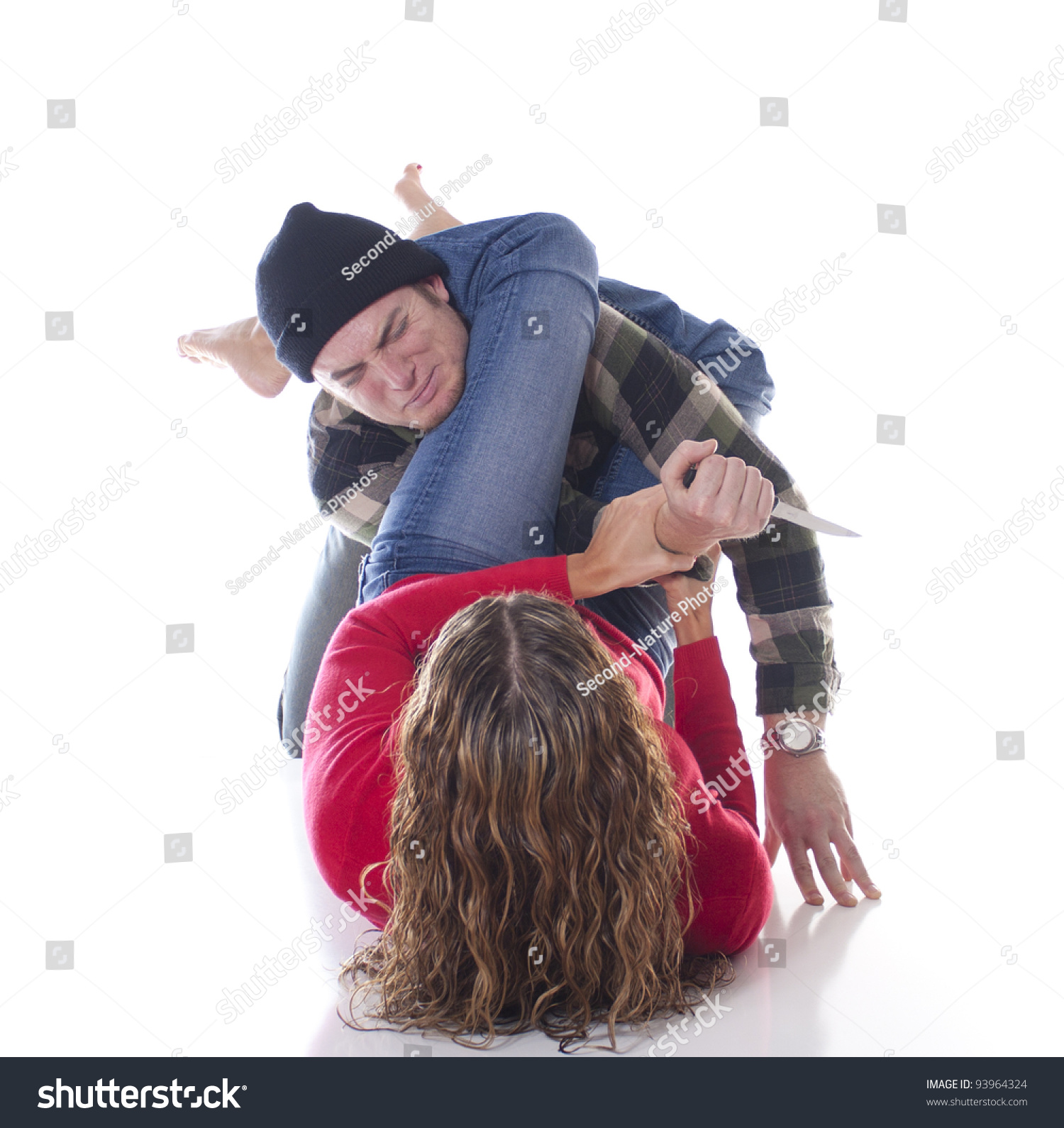 Woman Defending Herself Against A Mugger With A Jiu Jitsu Arm Bar Stock