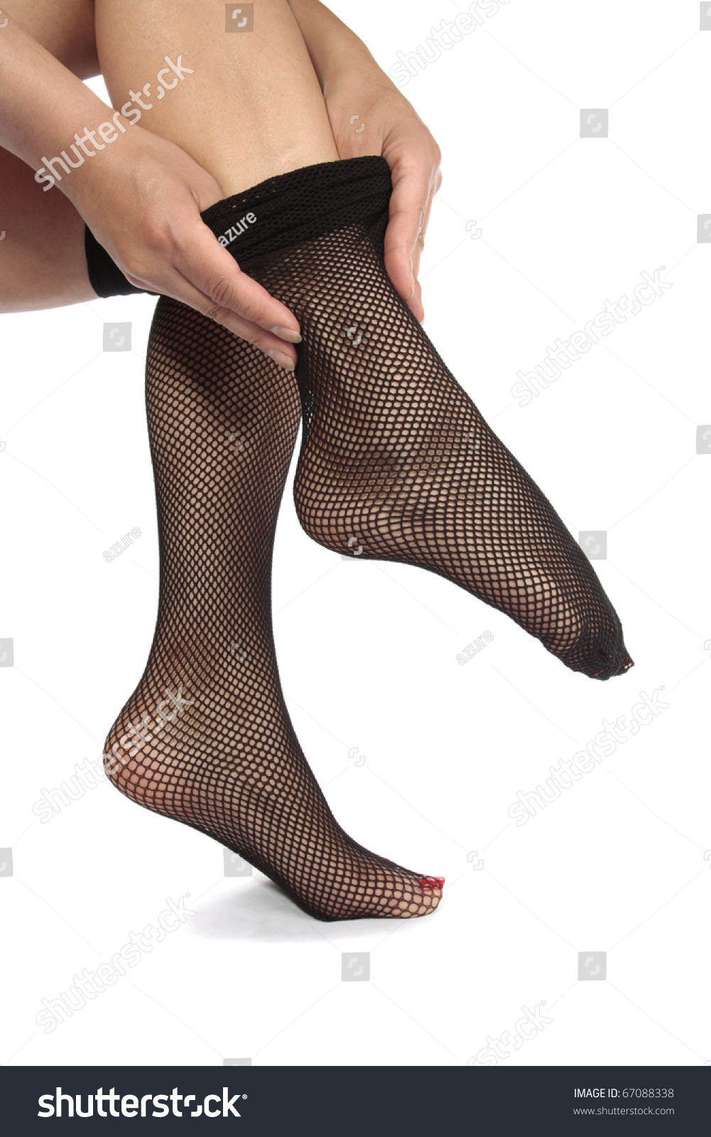 Woman Feet With Fishnet Tights Over White Background Stock Photo