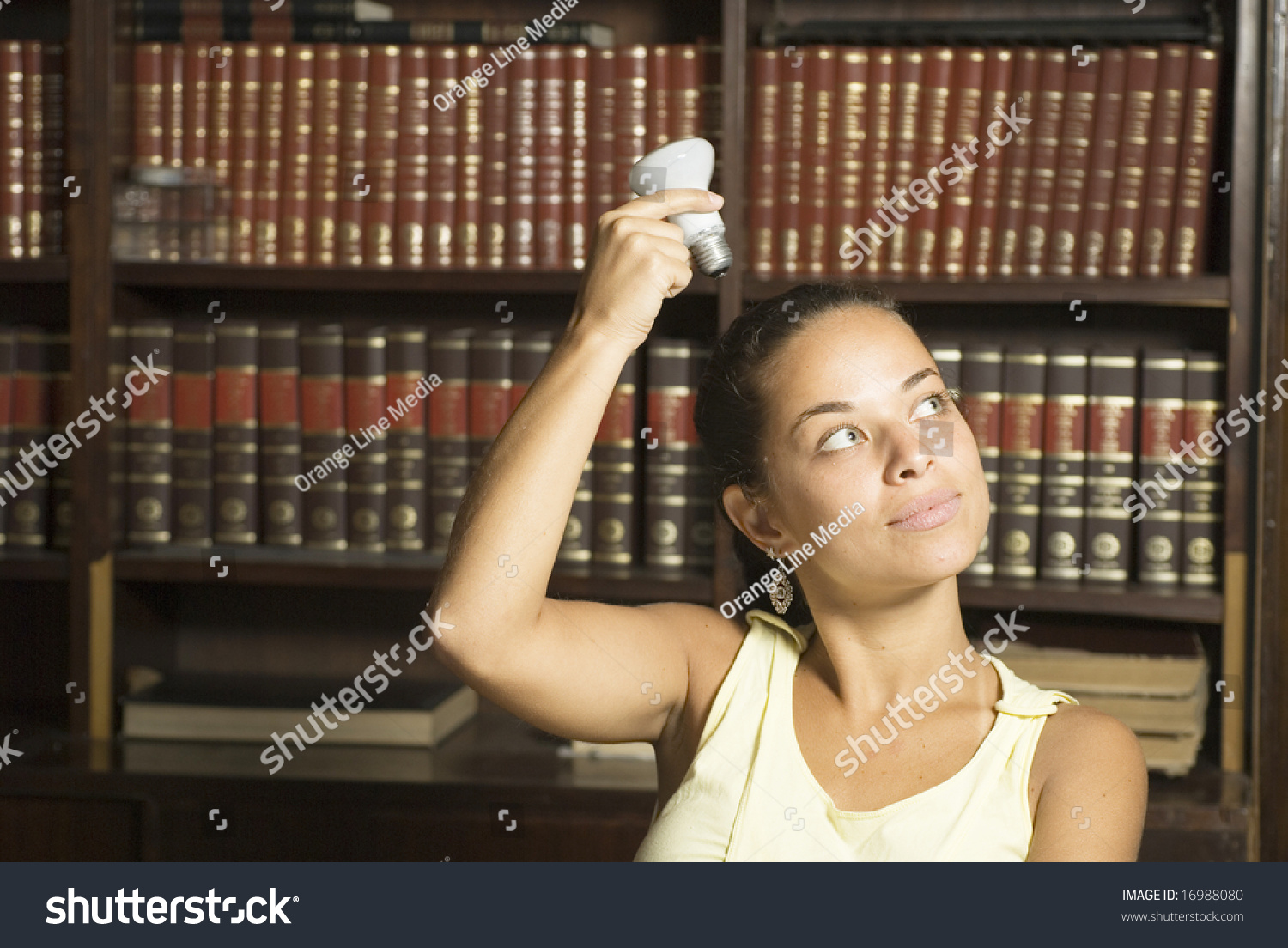 Woman Holding Light Bulb Over Head Horizontally Framed Photo 16988080 Shutterstock 