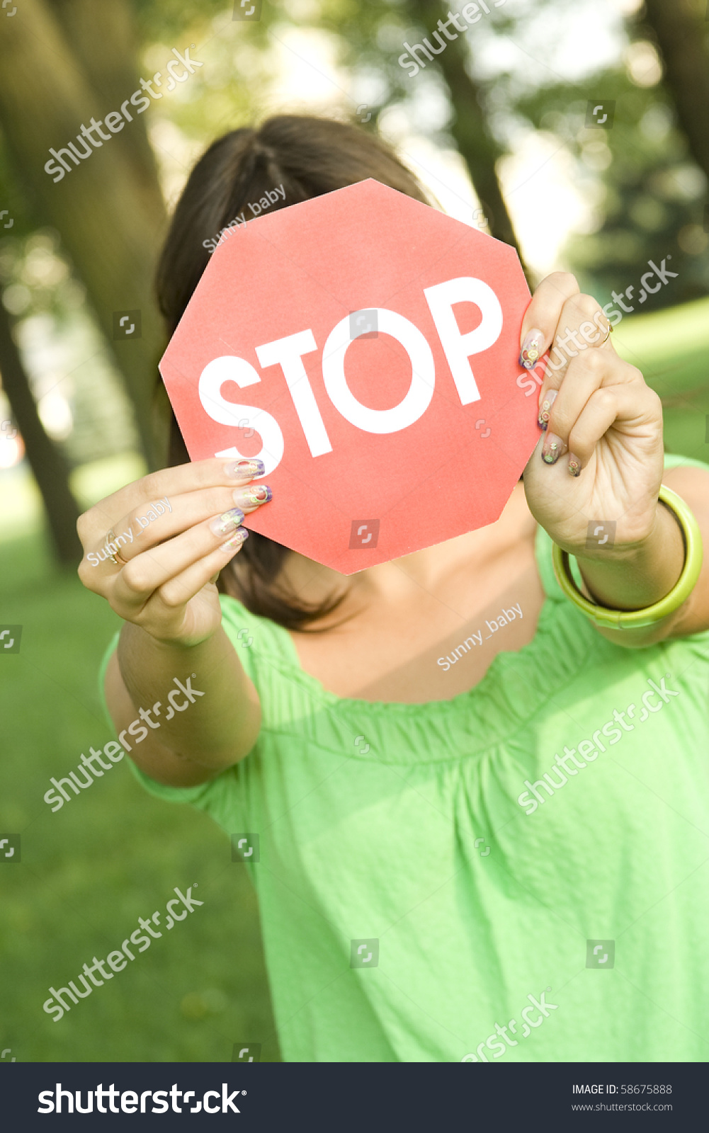 Woman Holding Stop Sign Outdoors In The Green Park Stock Photo Shutterstock