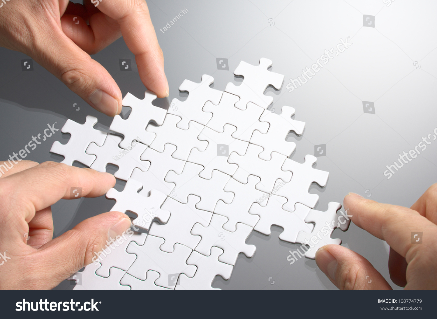 Working On An Arrow Shaped Jigsaw Puzzle. Concept Image Of Making