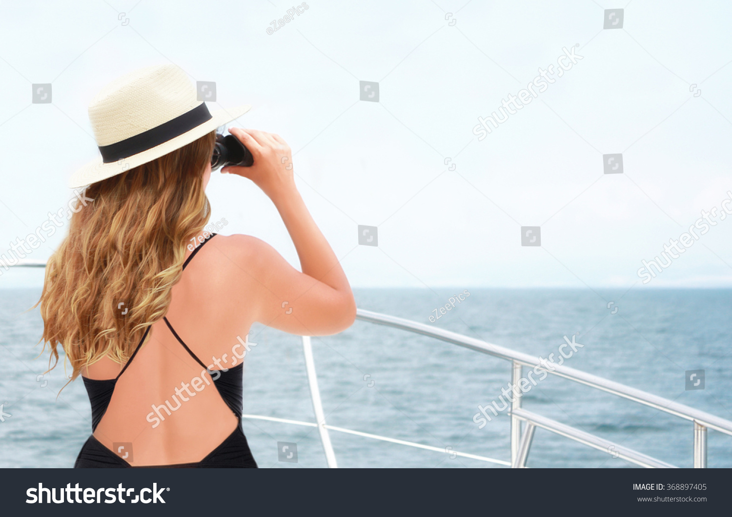 waxing all nude pore bikini woman with binoculars on boat
