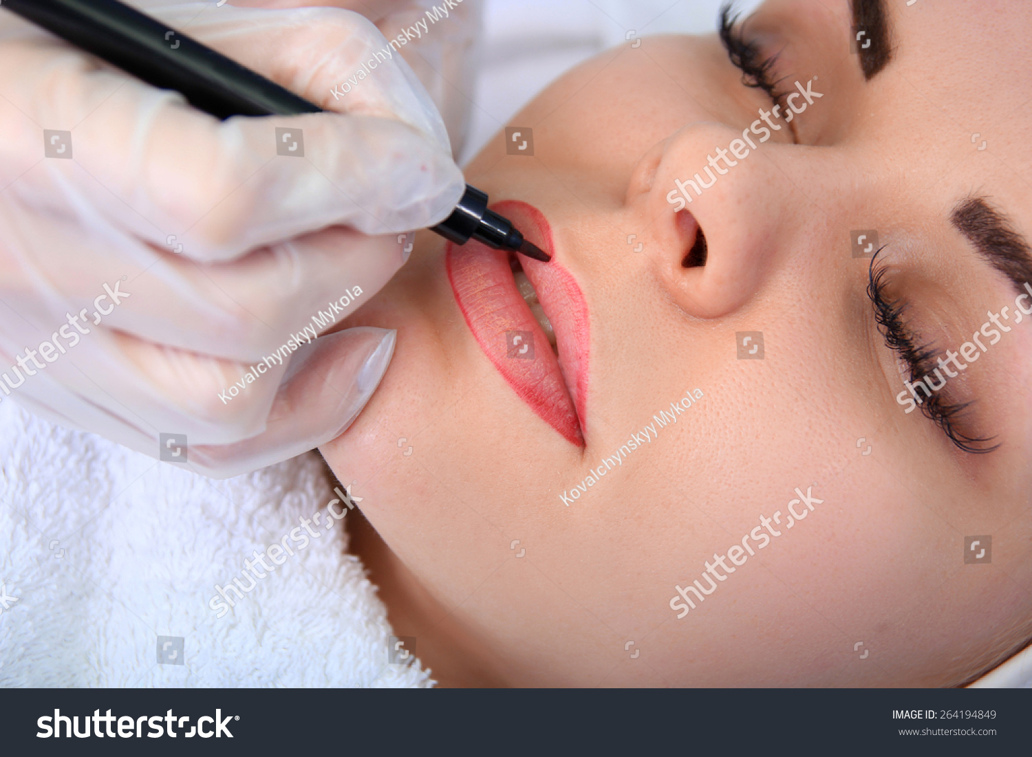 Young beautiful woman having permanent make-up Tattoo Young beautiful woman having permanent make-up Tattoo