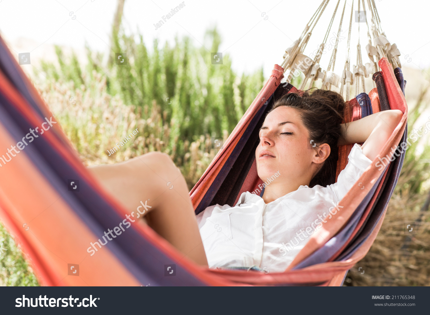 Young Beautiful Woman Sleeping On Hammock In The Very Hot Summer Day On The Beach Or Desert 0286