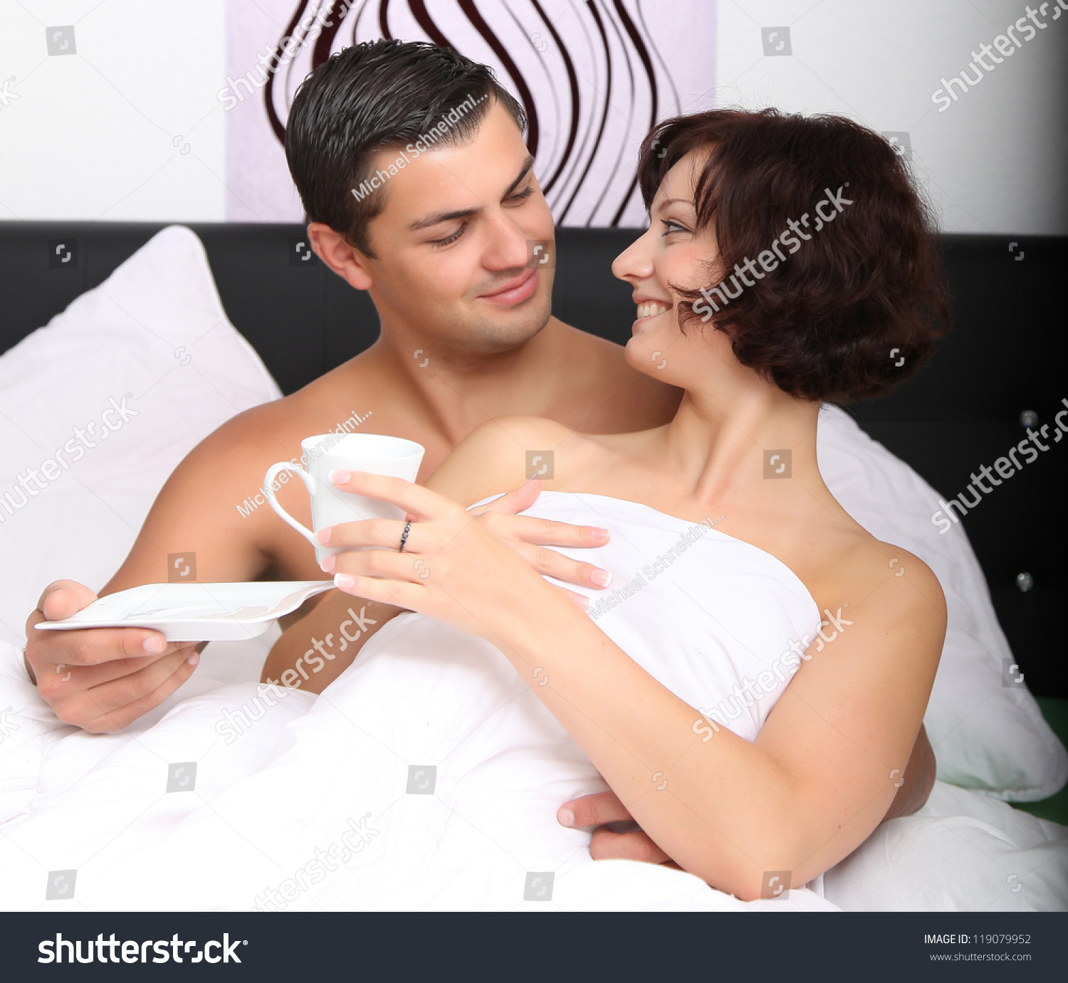 stock-photo-young-couple-drinking-coffee-in-bed-119079952.jpg