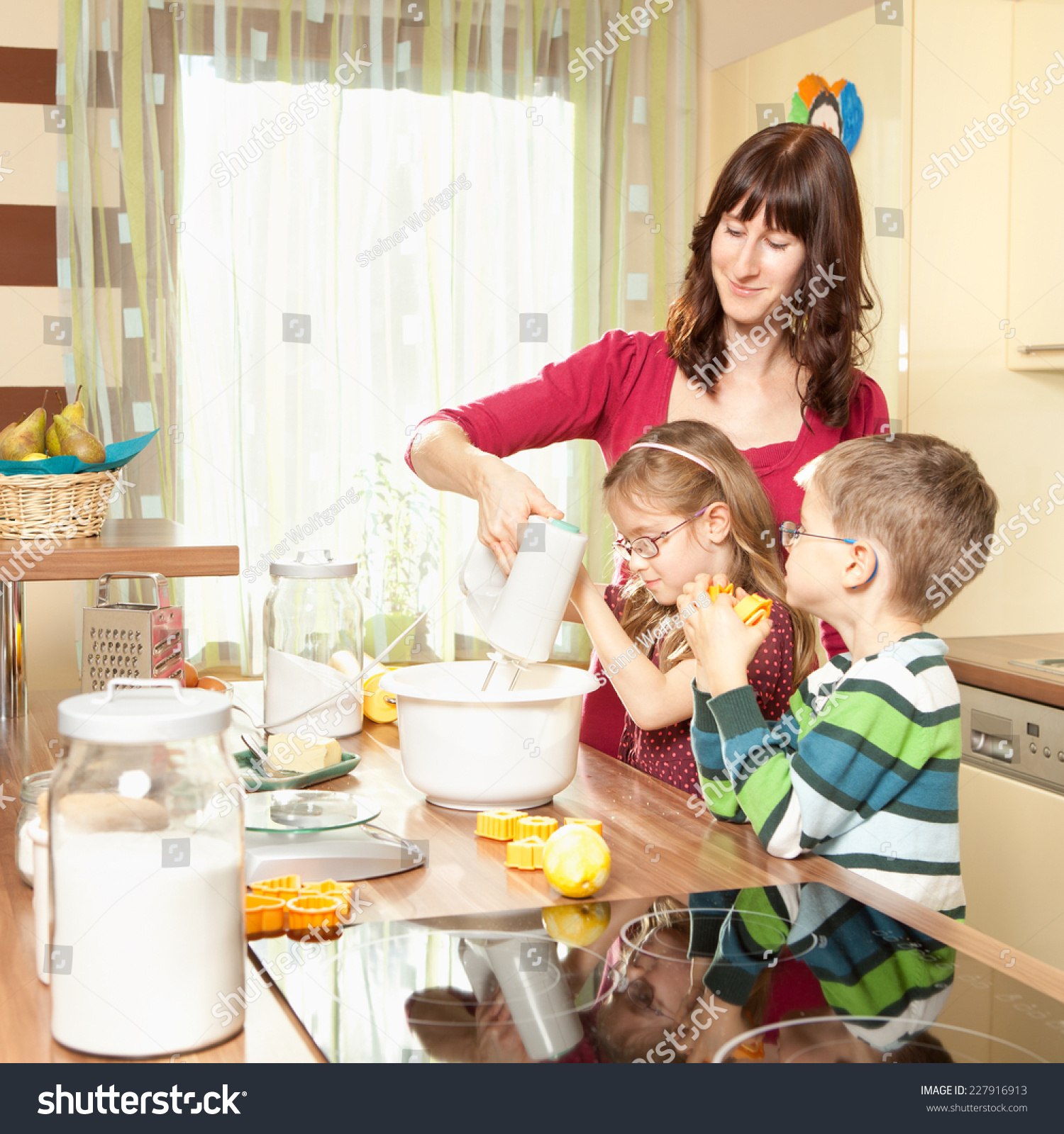 Young Family Baking In The Kitchen Stock Photo 227916913 : Shutterstock