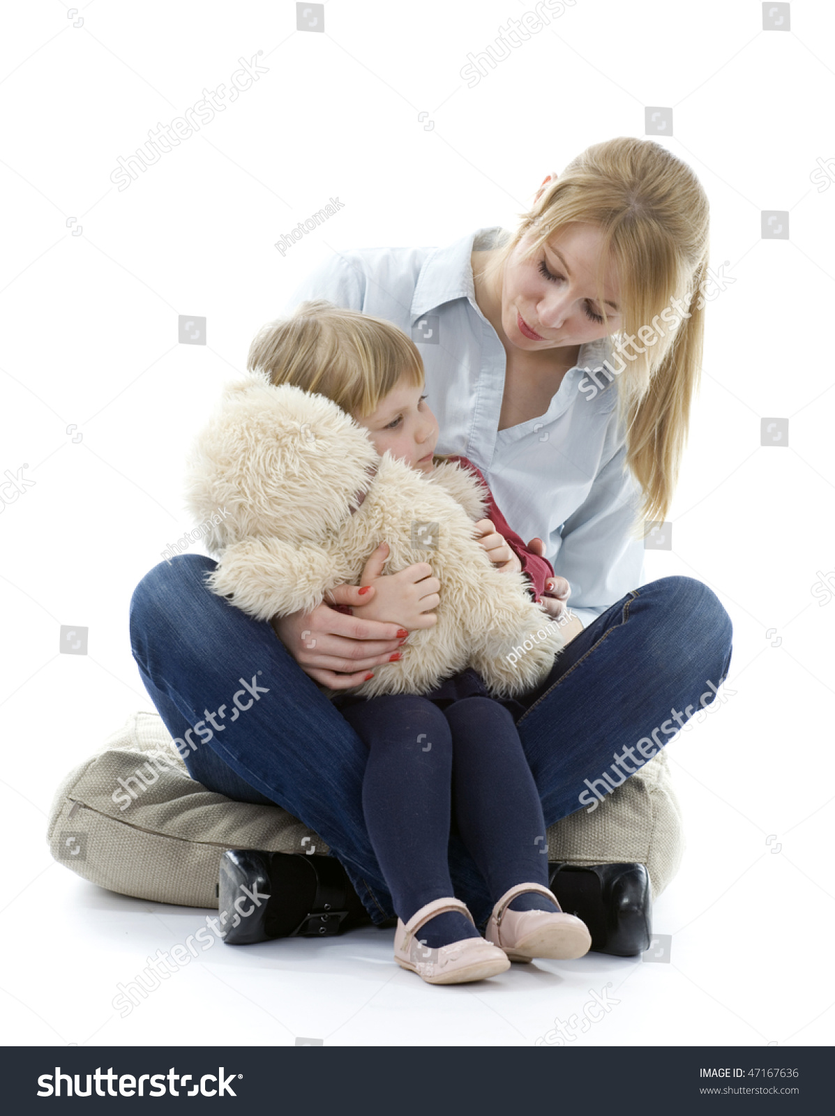 girl hugging a teddy bear