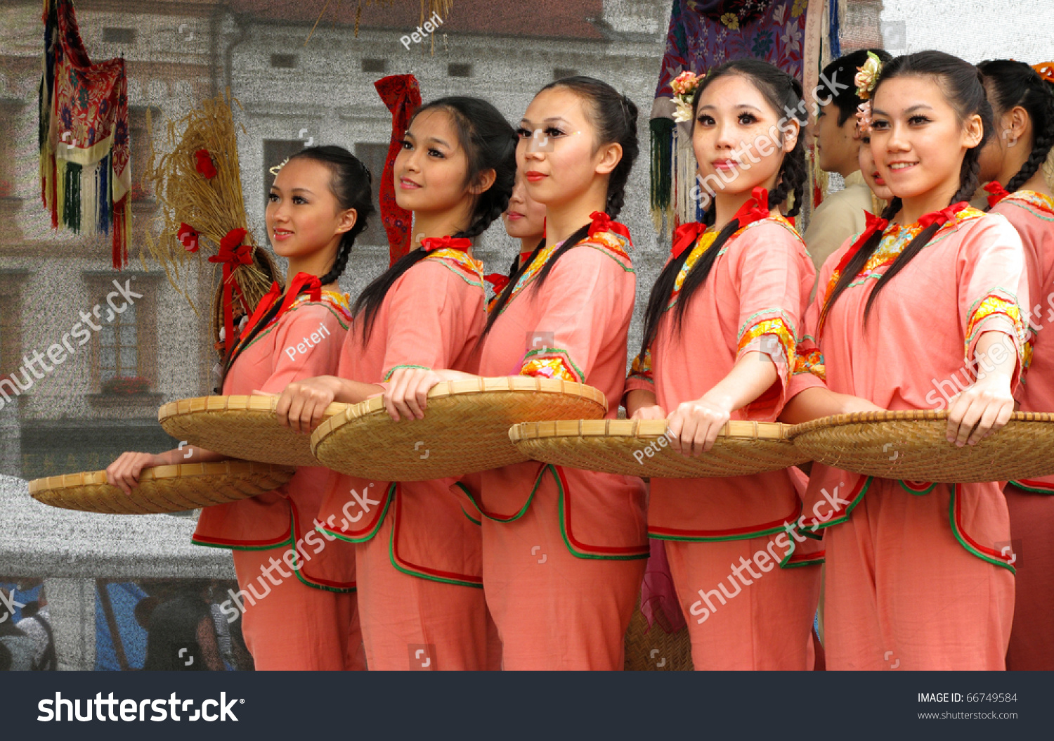 Young Girls From Taiwan In Traditional Clothes With Straw Baskets 