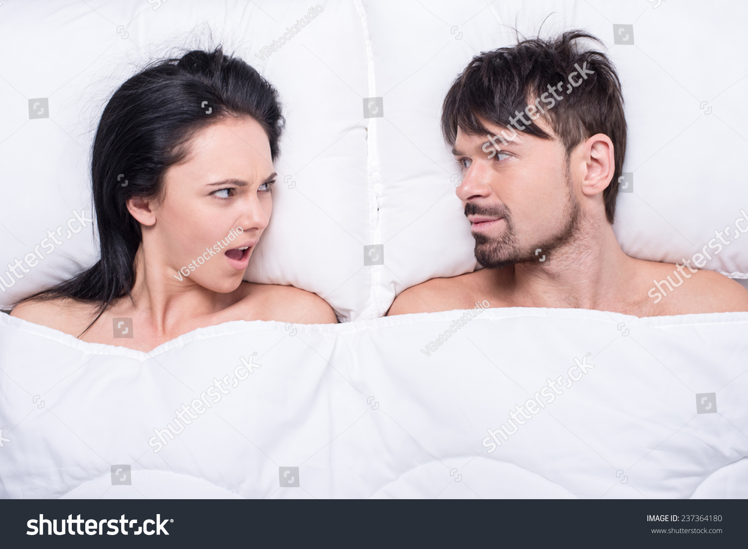 Young Happy Couple In A Bed Top View They Are Looking At Each O