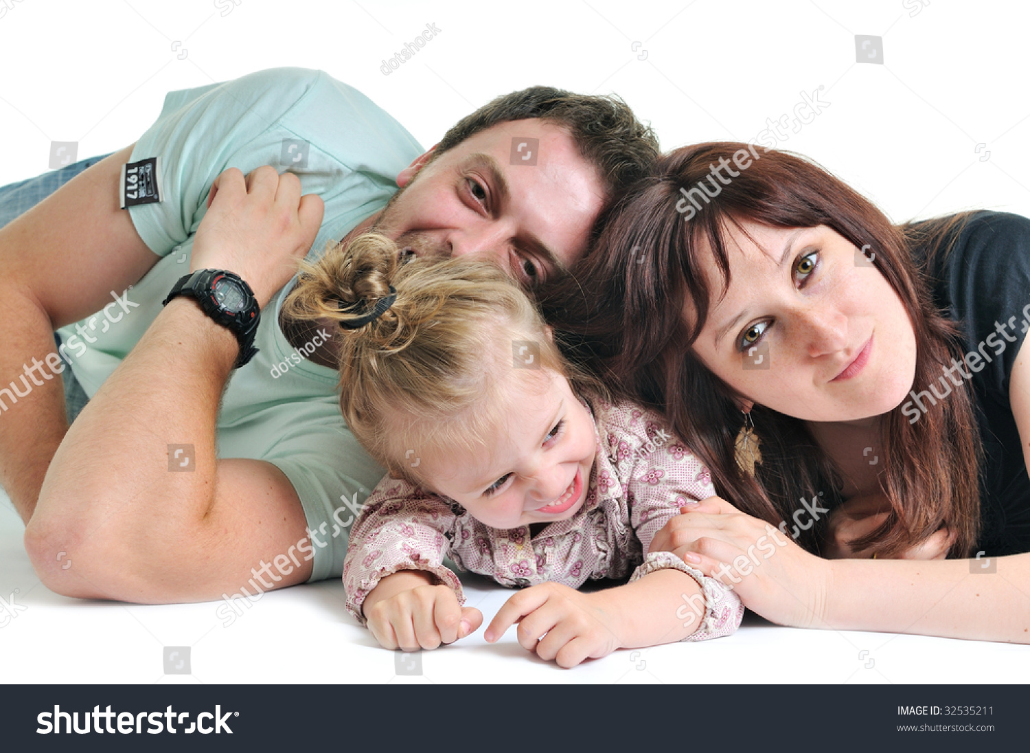 young happy family with beautiful baby playing and smile isolated on white in studio young happy family with beautiful baby playing and smile isolated on white in studio