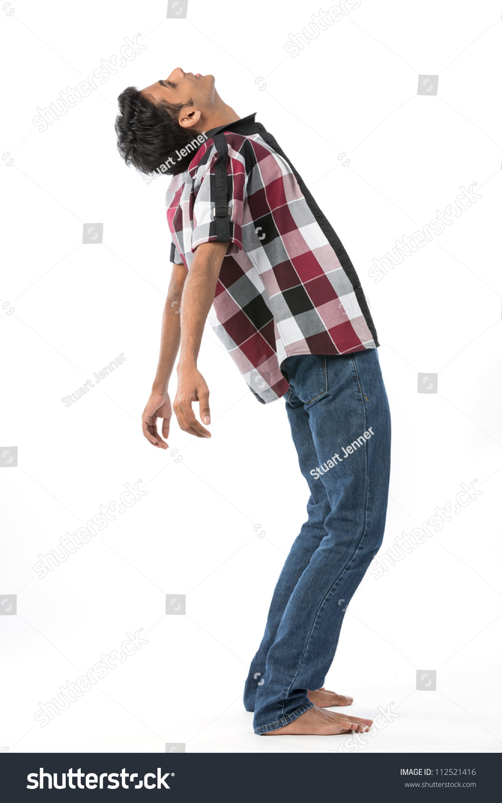 Young Indian Man Leaning Backwards. Isolated On White Background Stock