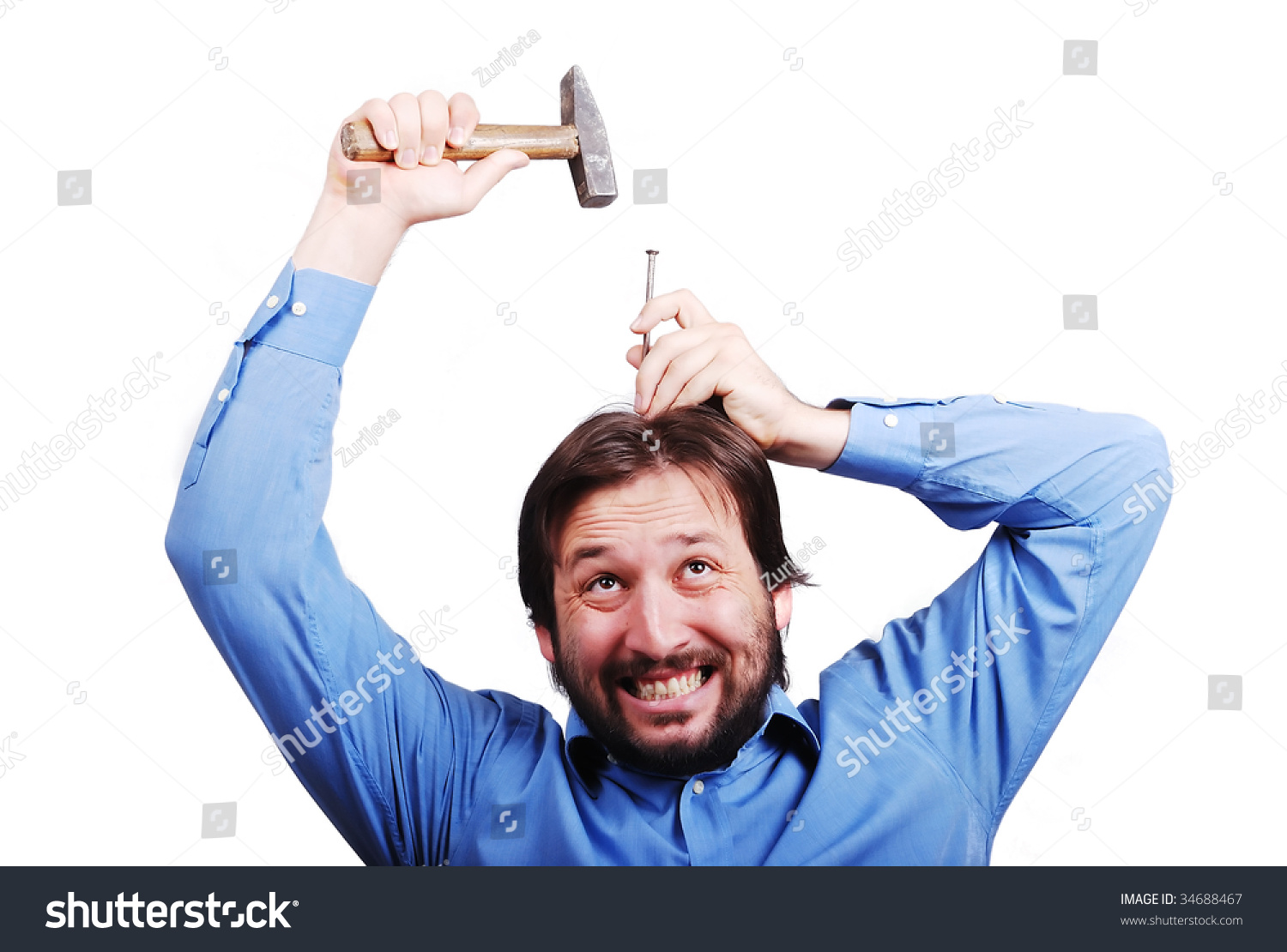 stock-photo-young-man-is-about-to-put-nail-into-his-head-with-a-hammer-34688467.jpg