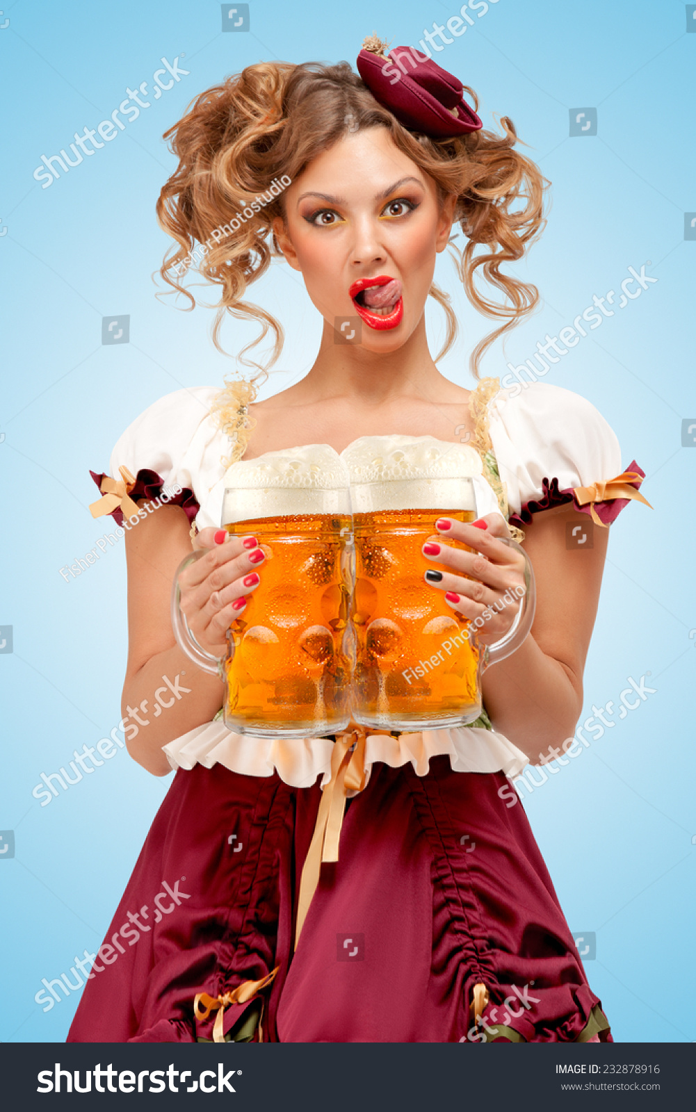 Young Sexy Oktoberfest Waitress Wearing A Traditional Bavarian Dress Dirndl Serving Two Big 