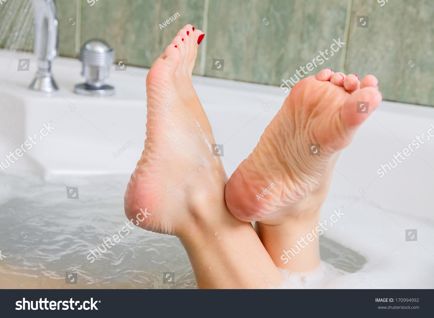 Young Woman Getting A Bath Feet CloseUp Indoor Bathroom Interrior