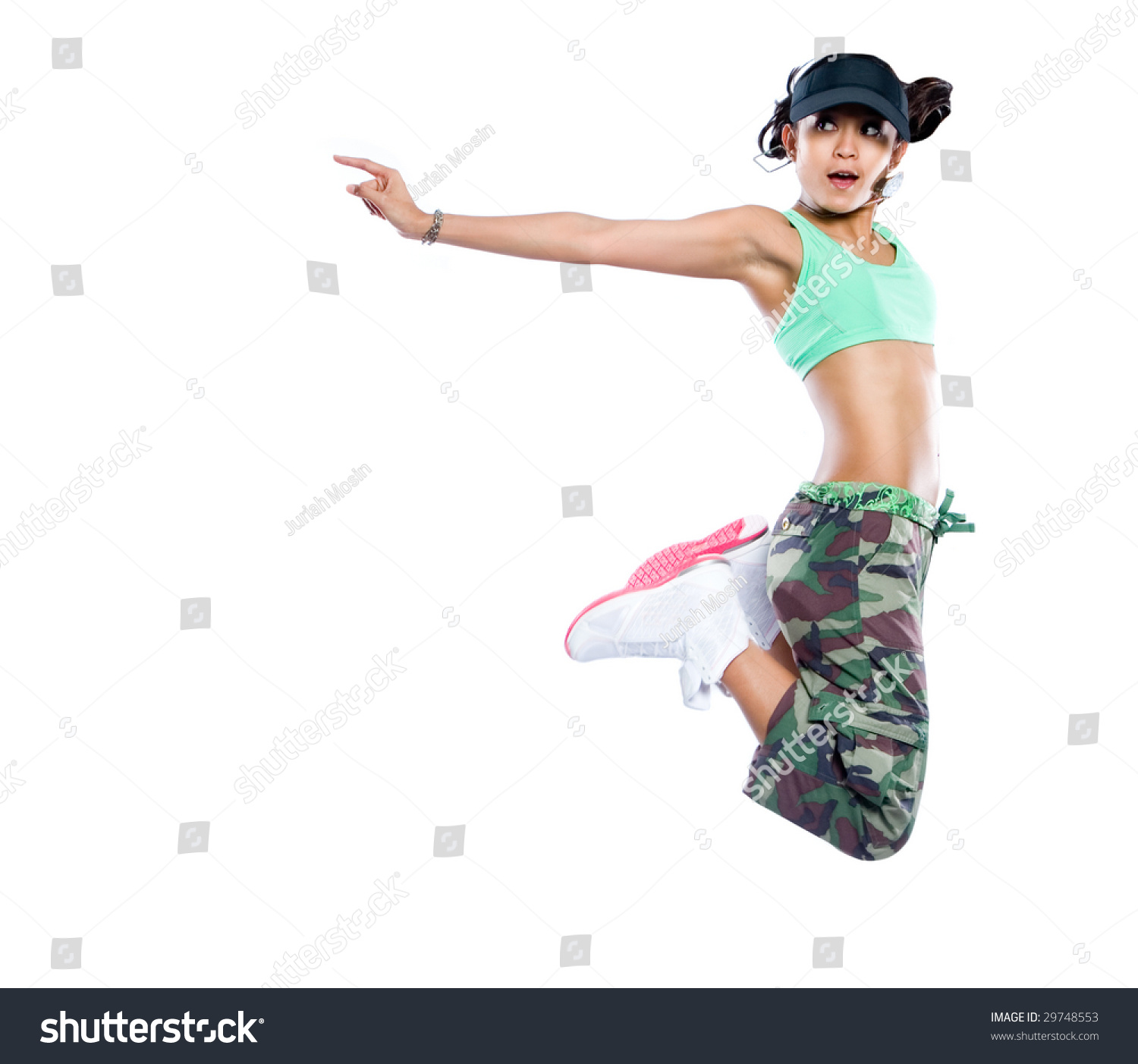 Young Woman Hip Hop Dancer Jumps Up High In The Air In A Pose Stock ...