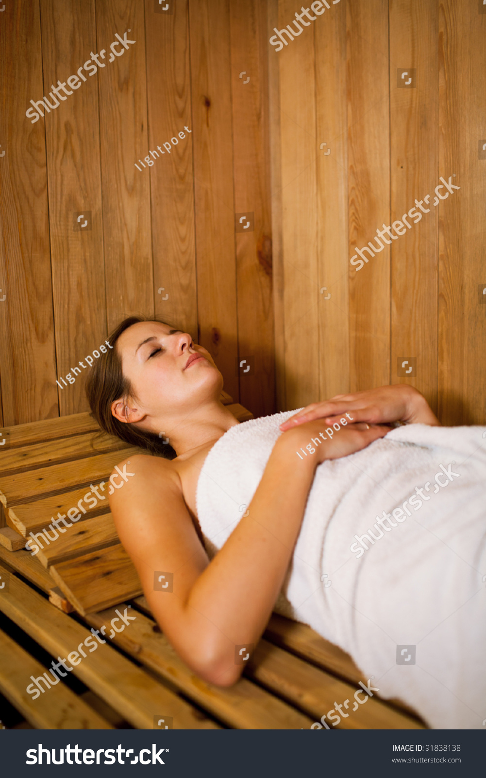 Beautiful Woman Relaxing In Sauna And Staying Healthy 
