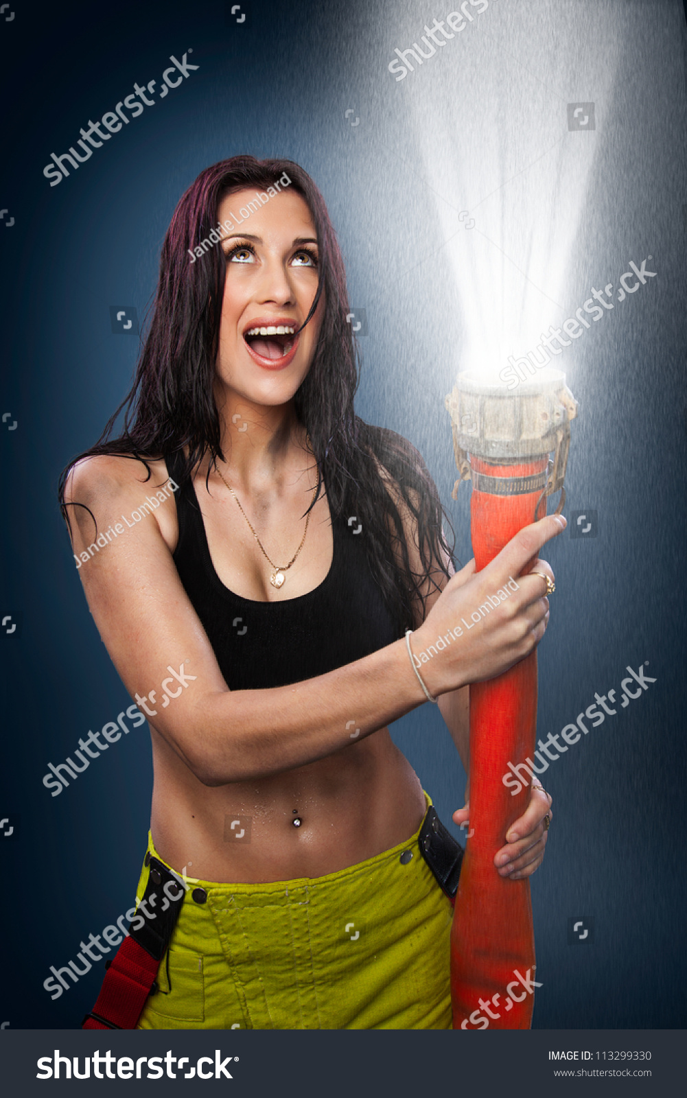 Young Woman Spraying Wate