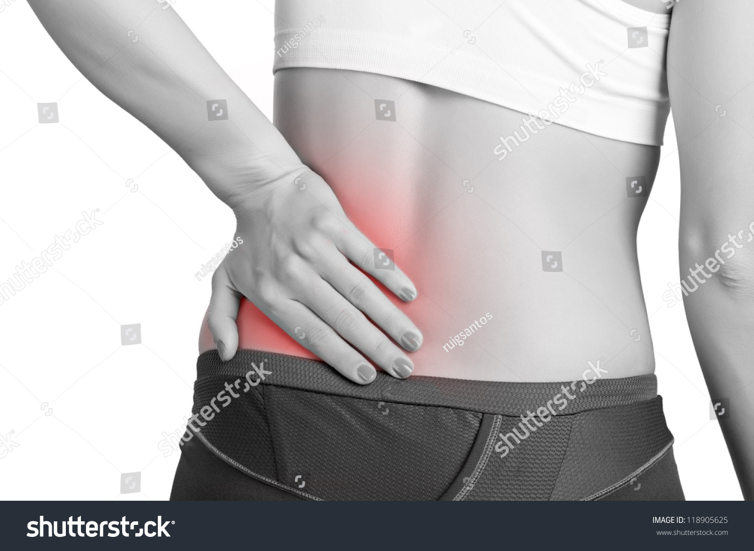 Young Woman With Pain In Her Lower Back Stock Photo