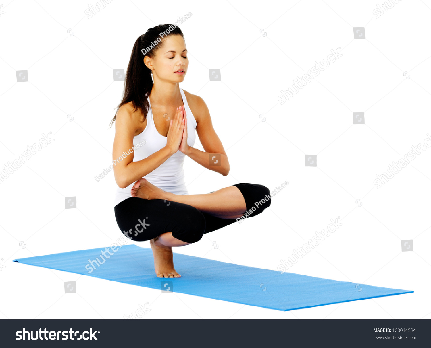 and poses  pose yoga relaxed zen of  a is in yoga woman part Zen calm. This mountain