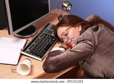 beautiful businesswoman asleep at work