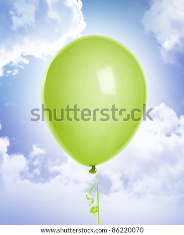 green balloon on blue sky