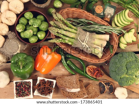 green and orange vegetables on wooden table