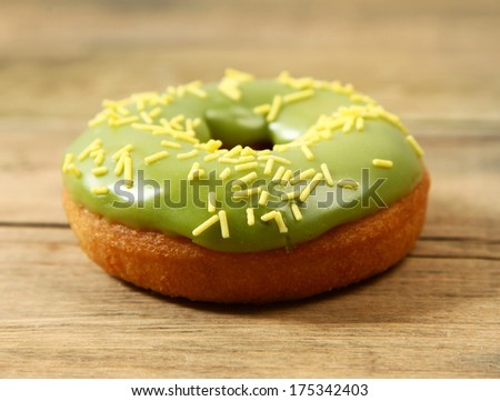 sweet bright donut on wooden background