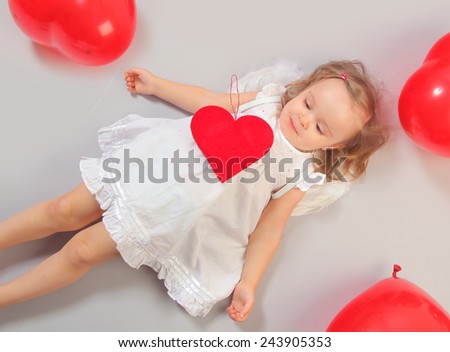 cute little angel girl with red heart