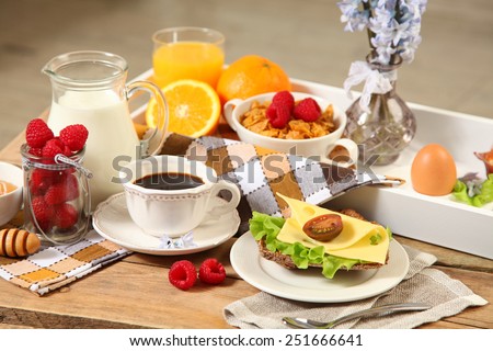 healthy continental breakfast on wooden table