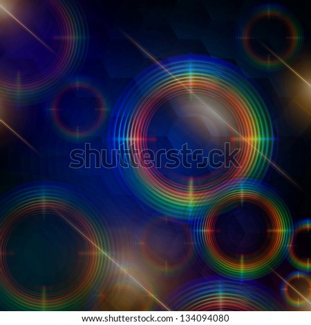 abstract rainbow rings shining over dark blue background with hexagons and lights