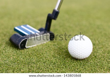 Illustration of a golf ball on a green meadow