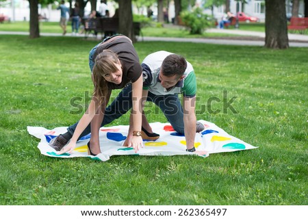 Students play a game in the park twister,