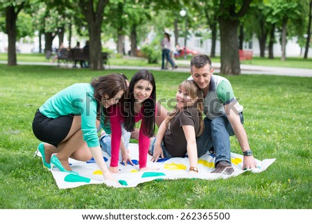 Students play a game in the park twister,