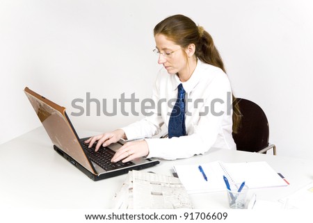 young woman sitting by office desk official dress code