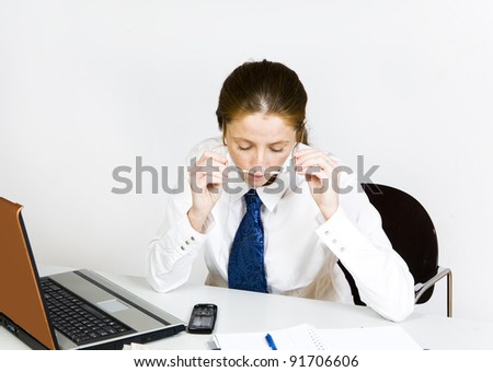 young woman sitting by office desk official dress code