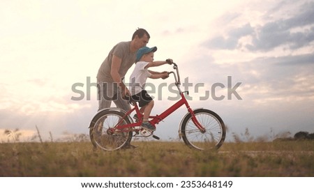 Similar – Image, Stock Photo Little boy riding bike in park