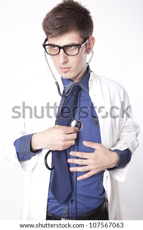 Young male doctor listening heart.