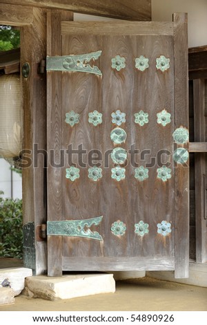 Ancient wooden door of Japanese temple.