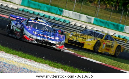 TEAM KUNIMITSU head to head with HASEMI MOTOR SPORT YellowHat YMS during Round 4 Super GT action of 2007 in Sepang Malaysia