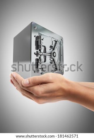Man hand holding object ( steel safe )  High resolution