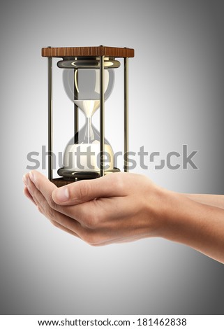 Man hand holding object ( hourglass sand clock )  High resolution