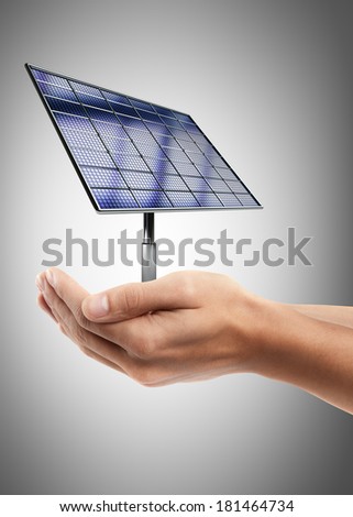 Man hand holding object ( Solar battery panel )  High resolution