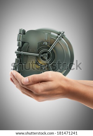 Man hand holding object ( bank vault door )  High resolution