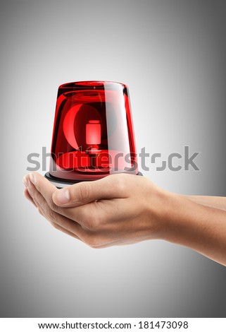 Man hand holding object ( red siren ) High resolution