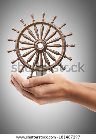 Man hand holding object ( wooden steering-wheel )  High resolution