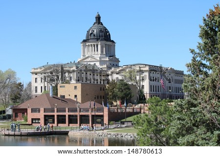 PIERRE, SOUTH DAKOTA-MARCH 31: View of the South Dakota State Capitol in PIerre on March 31st, 2012 showing visitors on a sunny spring day.